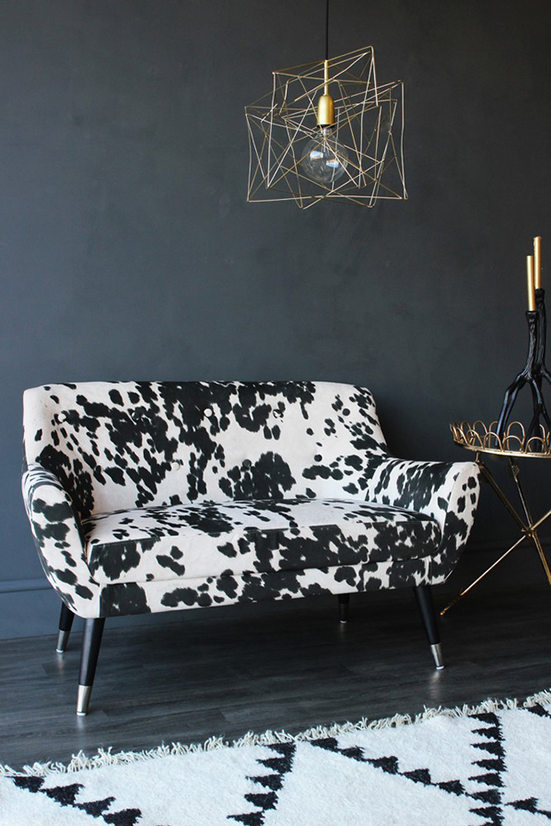faux cow print 2 seater small sofa lowres. Butaca tapizada con print de piel de vaca, de Rockett St.George