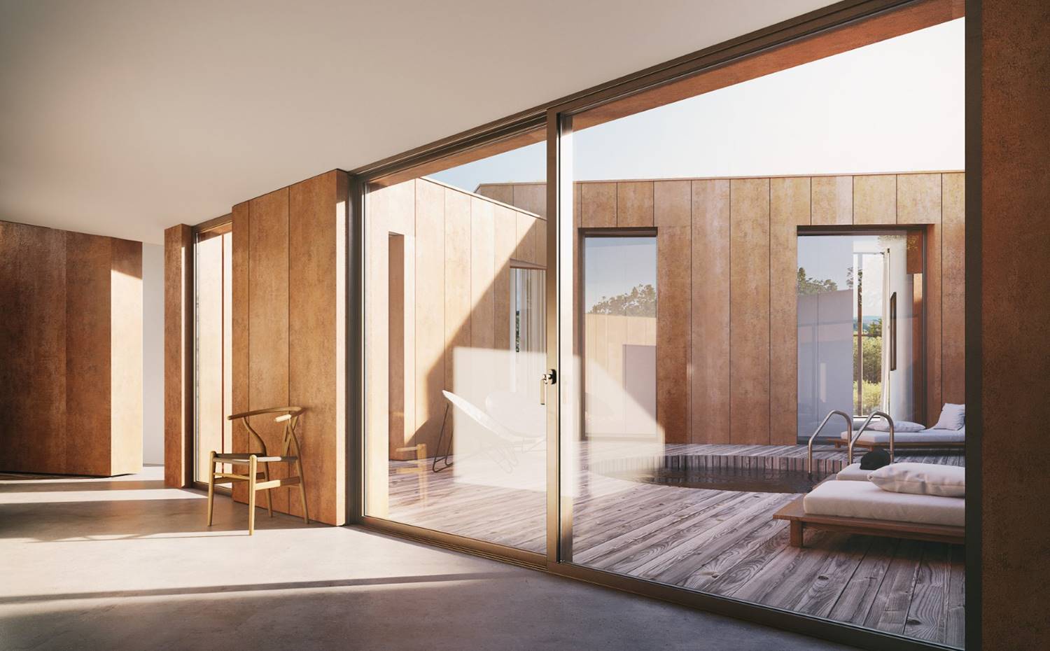 Cerramientos de cristal, revestimiento de madera, suelo madera exterior, bañera exterior, patio exterior. El patio interior, alrededor del cual se encuentra la circulación principal de la vivienda, ofrece una sensación de intimidad que contrasta con las grandes aperturas al exterior que brinda gran parte de la casa. 