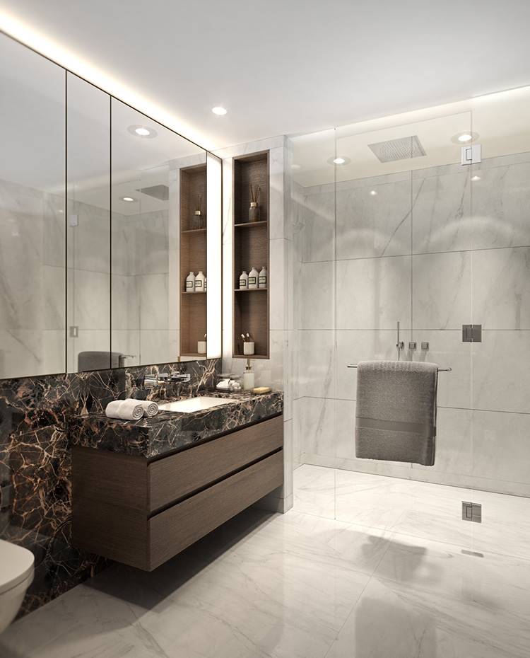 Baño revestimiento marmol, ducha de obra, cerramiento cristal, mueble lavabo madera. Para este proyecto, el estudio March & White ha prestado especial atención en los materiales y acabados, jugando con diseños elegantes con toques vanguardistas.