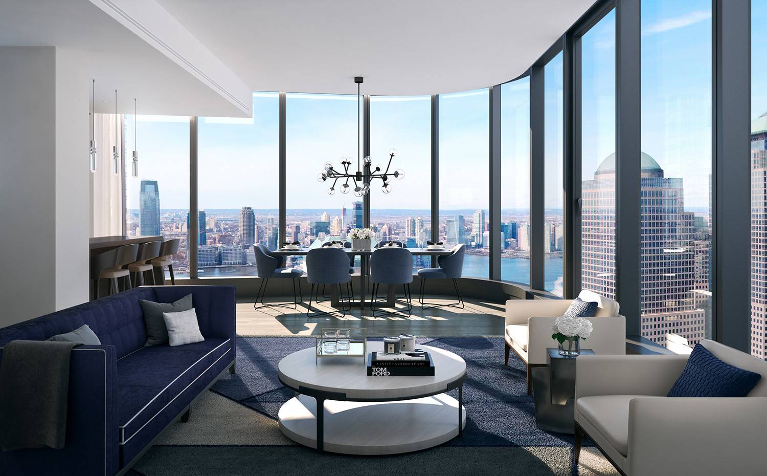 Salón, mesa de centro redonda, sofá azul marino, cerramiento cristal, vistas skyline, butacas de piel. El espacio compartido entre salón, comedor y cocina se viste de piezas envolventes de refinado diseño dispuestas en orden para separar ambientes y dejar que la imponente luz natural del exterior y sus vistas fluyan por la planta.