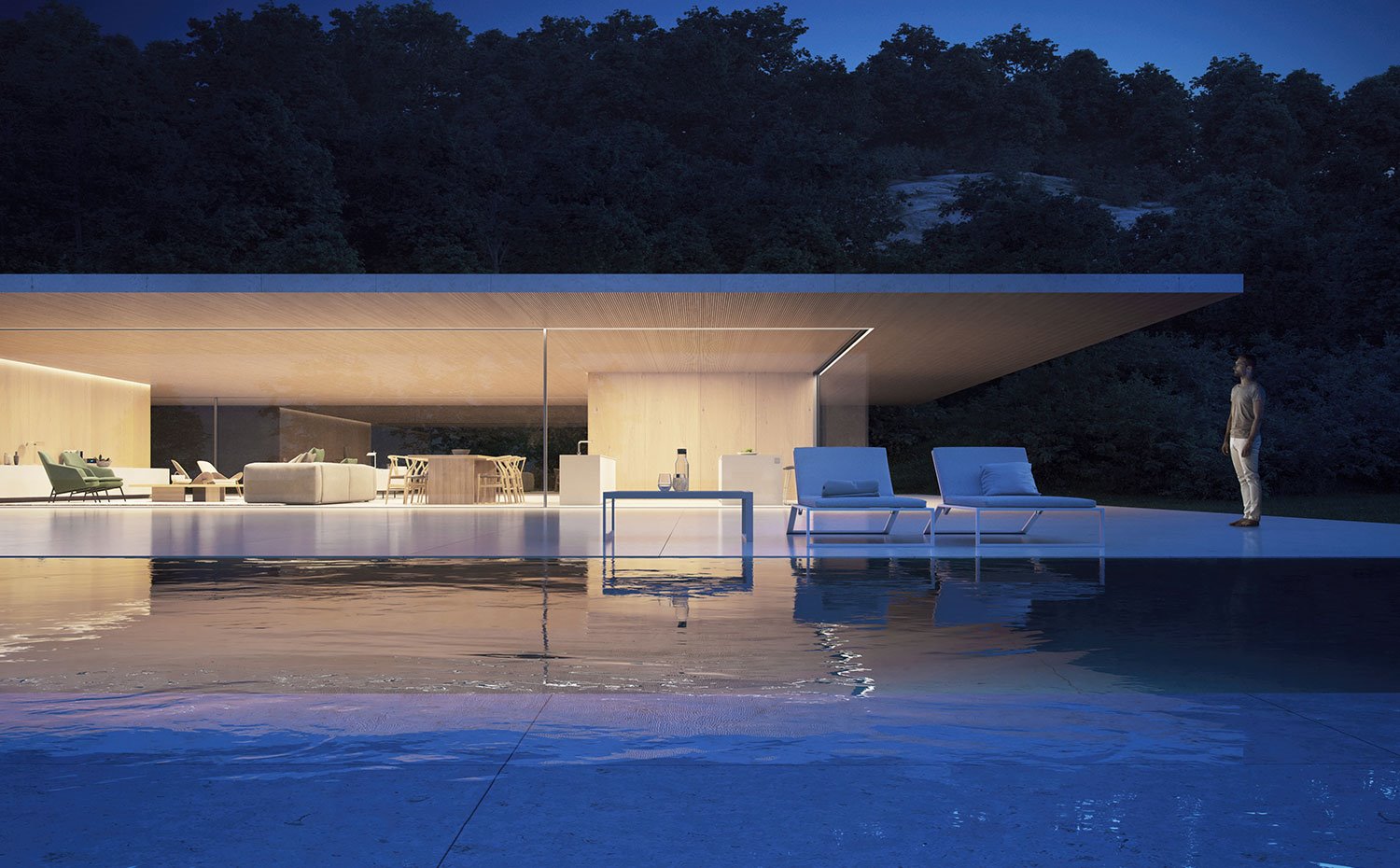 Hamacas junto a piscina frente a la cocina, comedor y salón del interior