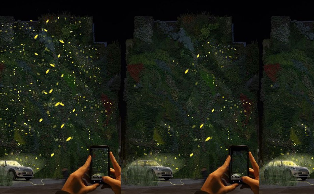 Las partículas lumínicas recuerdan a movimientos de insectos y viajan por todo el jardín vertical, consiguiendo un efecto hipnótico en medio de la ciudad.