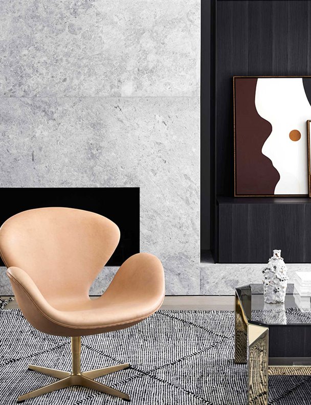 La elegancia atemporal se apodera de este apartamento cubierto de piedra y madera