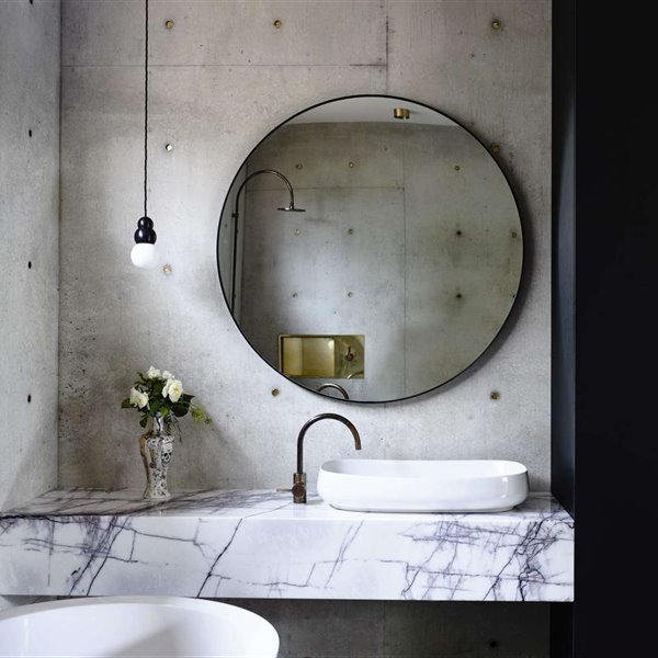 lavamanos de marmol con espejo redondo