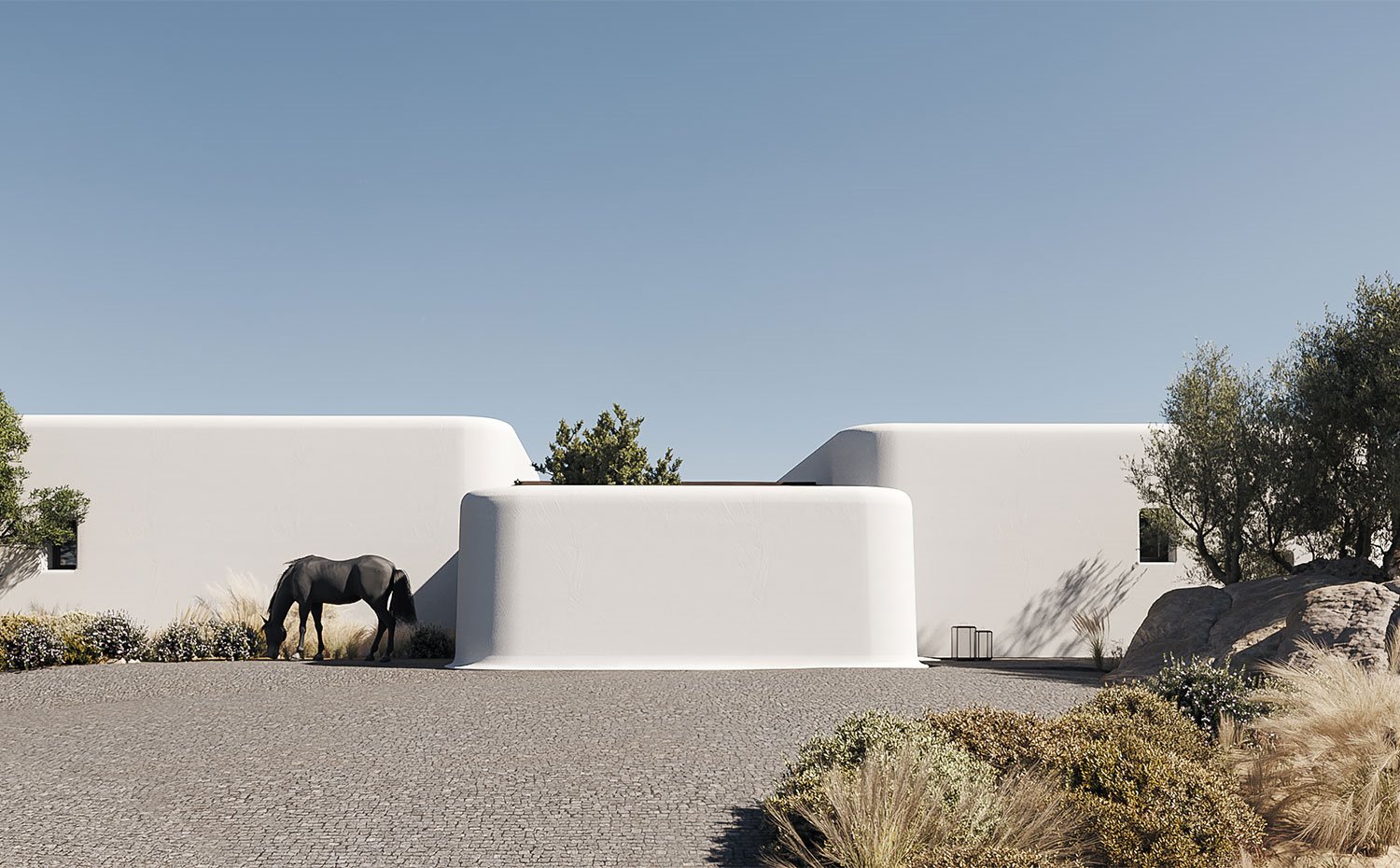 Estructuras exteriores acanaladas con suelo empedrado y caballo negro
