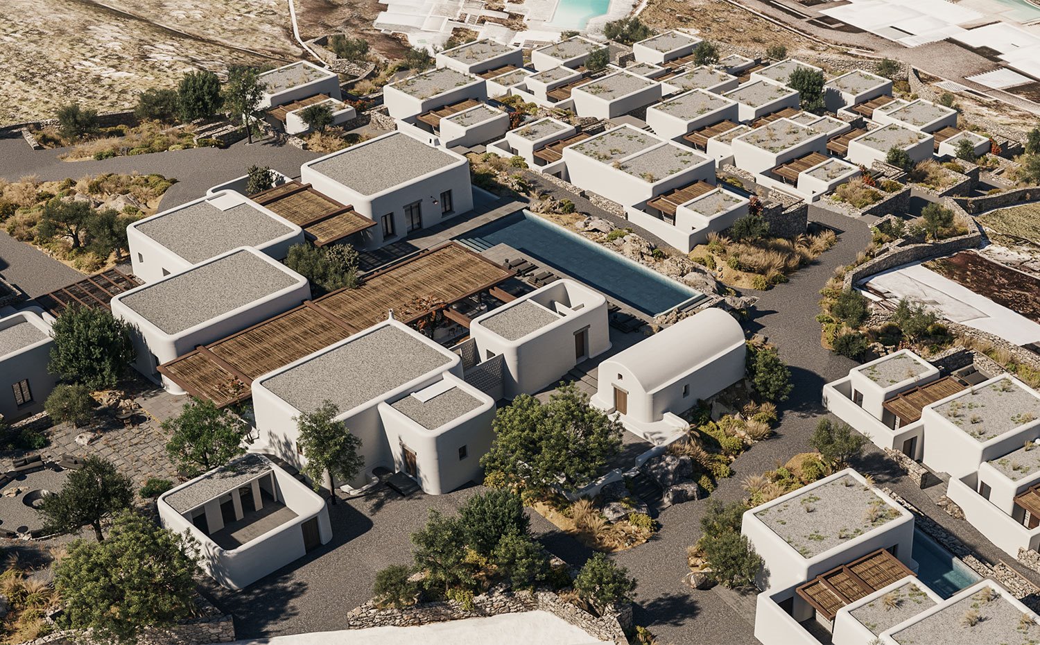 Vista aérea del complejo hotelero con construcciones encaladas de cantos curvos