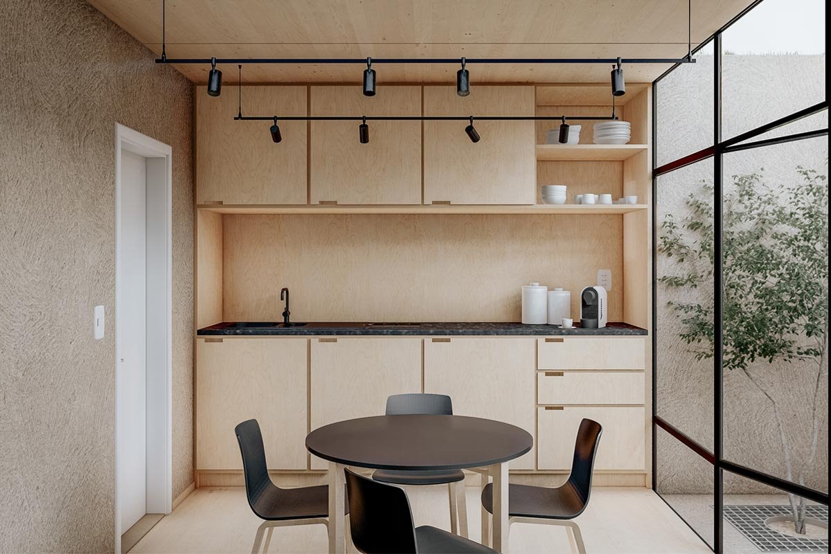 En su interior hay un escritorio integrado, una mesa para reuniones, una despensa y un baño.