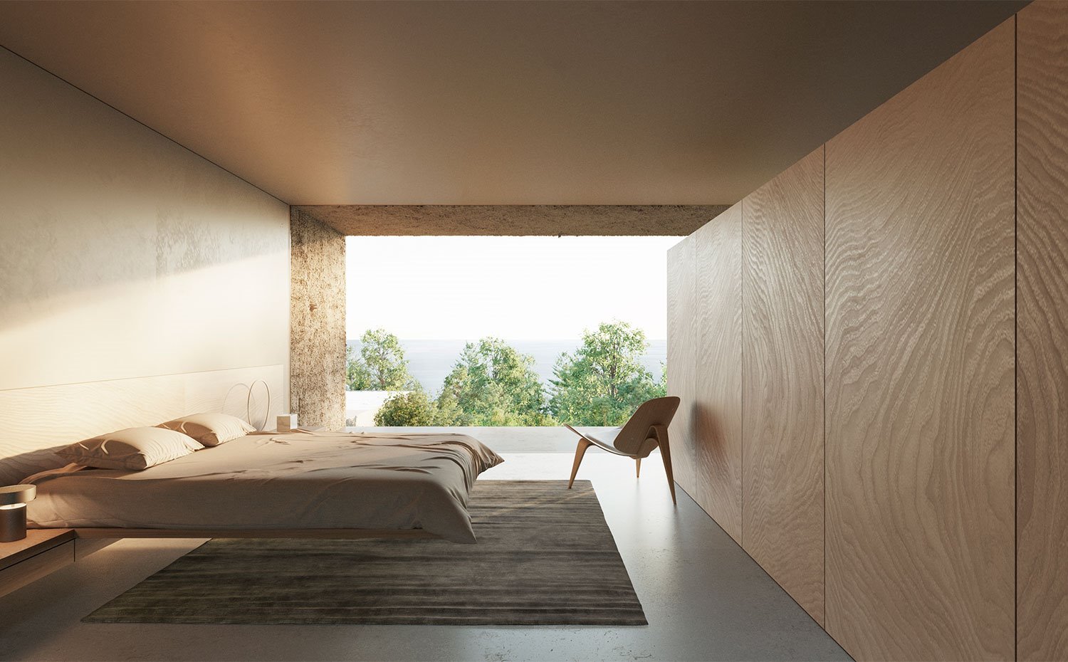 Dormitorio con butaca de madera y amplio frente de armario de madera veteada