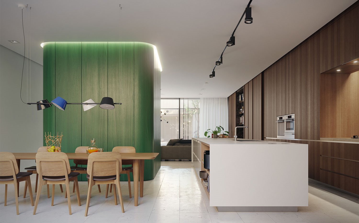 Comedor-con-mesa-y-sillas-de-madera-y-luminarias-suspendidas-con-difusores-de-colores,-cocina-abierta-en-isla