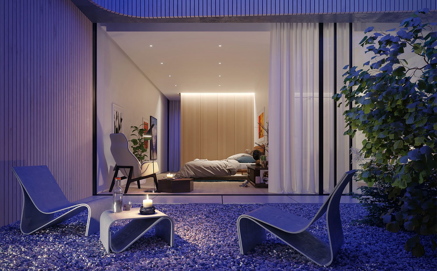 Piedras-de-cantos-rodados-en-terraza-con-mobiliario-exterior-de-formas-sinuosas-con-el-dormitorio-de-fondo