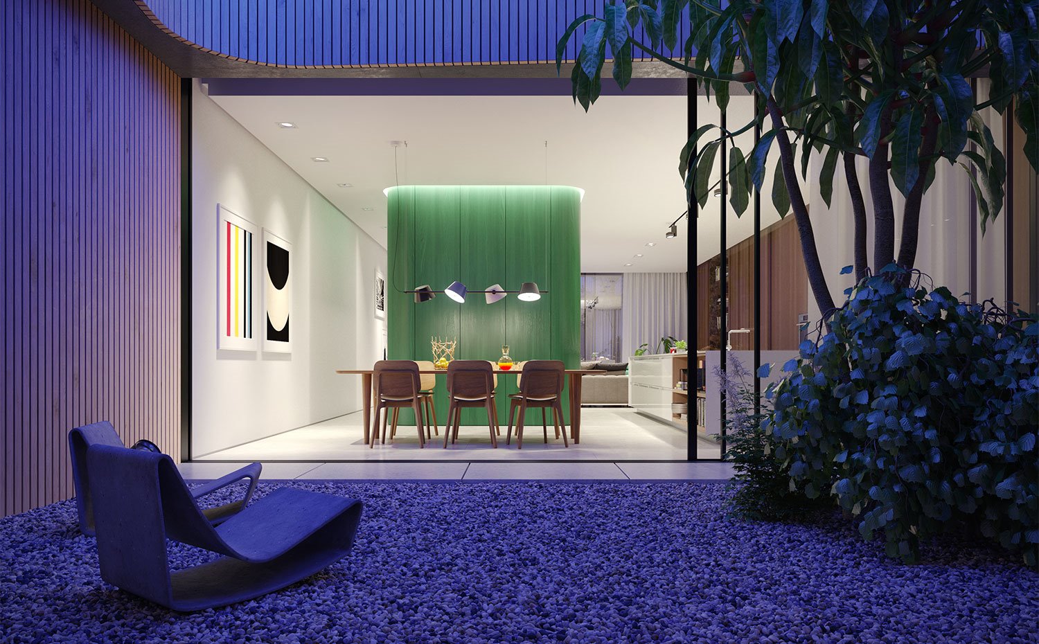 Vista-nocturna-con-juego-de-luces-de-colores-en-patio-junto-a-comedor-y-cocina