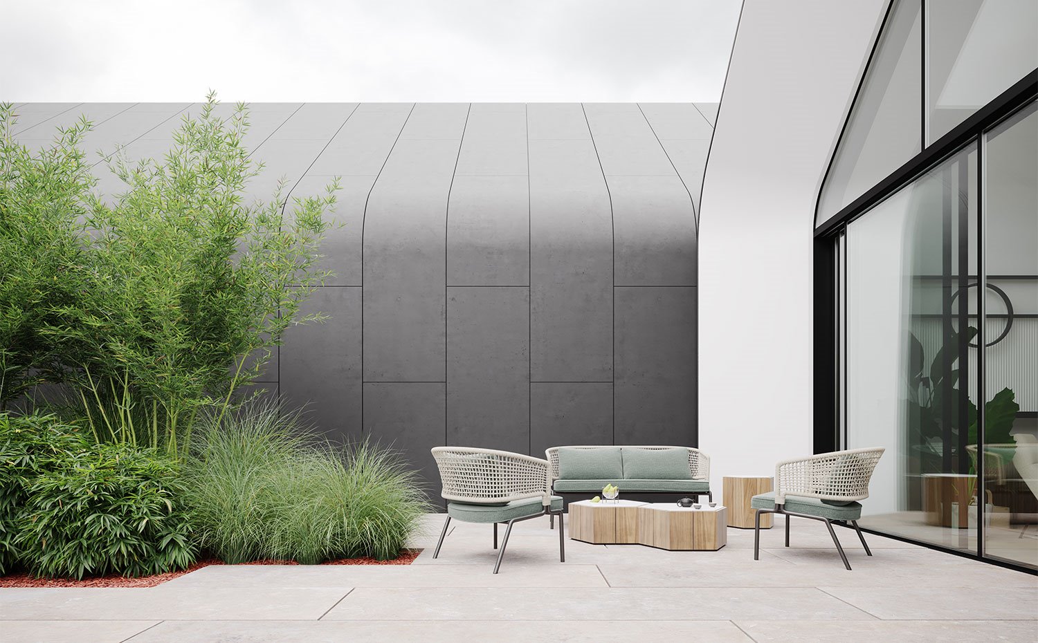 Patio con vegetación y mobiliario exterior en acabado madera y asientos tapizados en verde