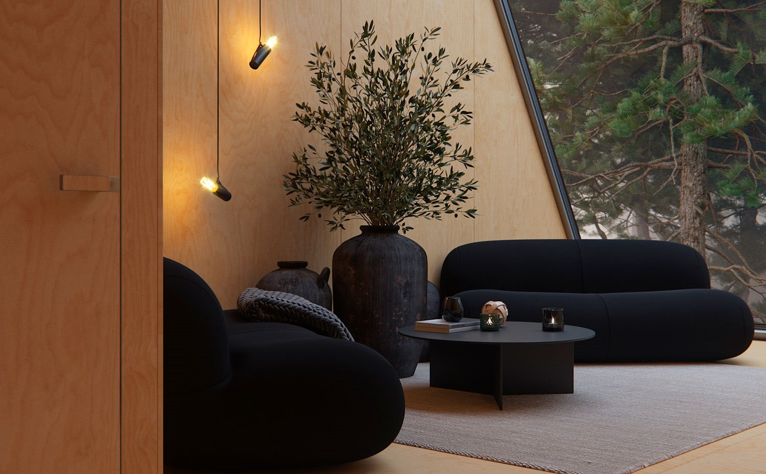 Salón con sofás en negro, grandes tinajas en gris antracita y mesa de centro circular, luminarias suspendidas junto a pared revestida de madera