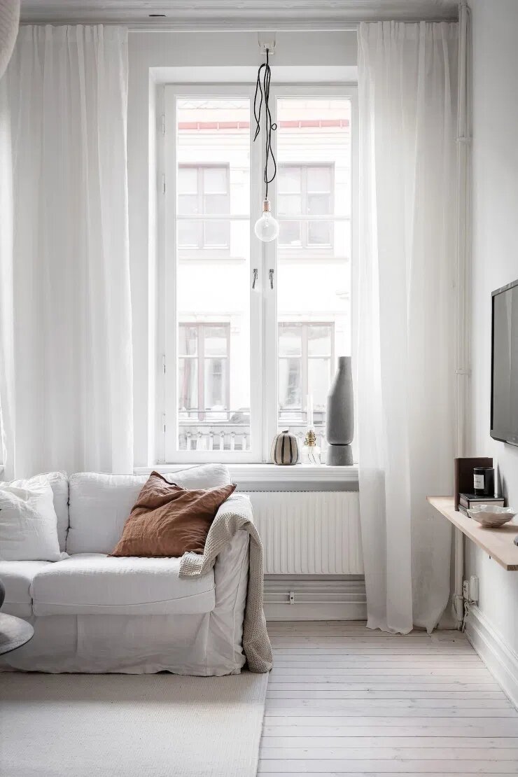 salon con cortinas fluidas de estilo nordico. Piscis (del 19 de febrero al 20 de marzo)
