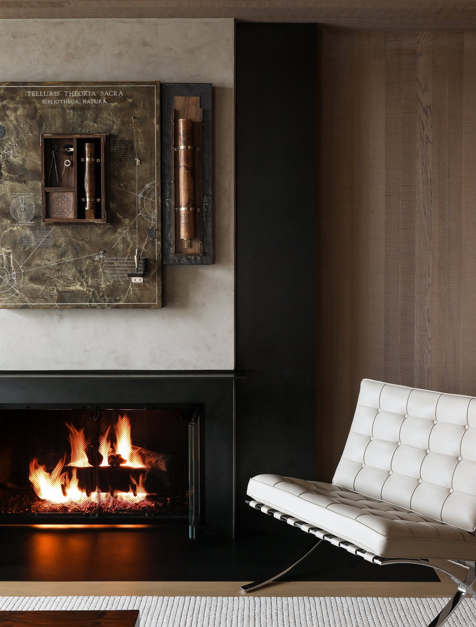 Casa moderna de madera con techo a dos aguas chimenea con butaca Barcelona