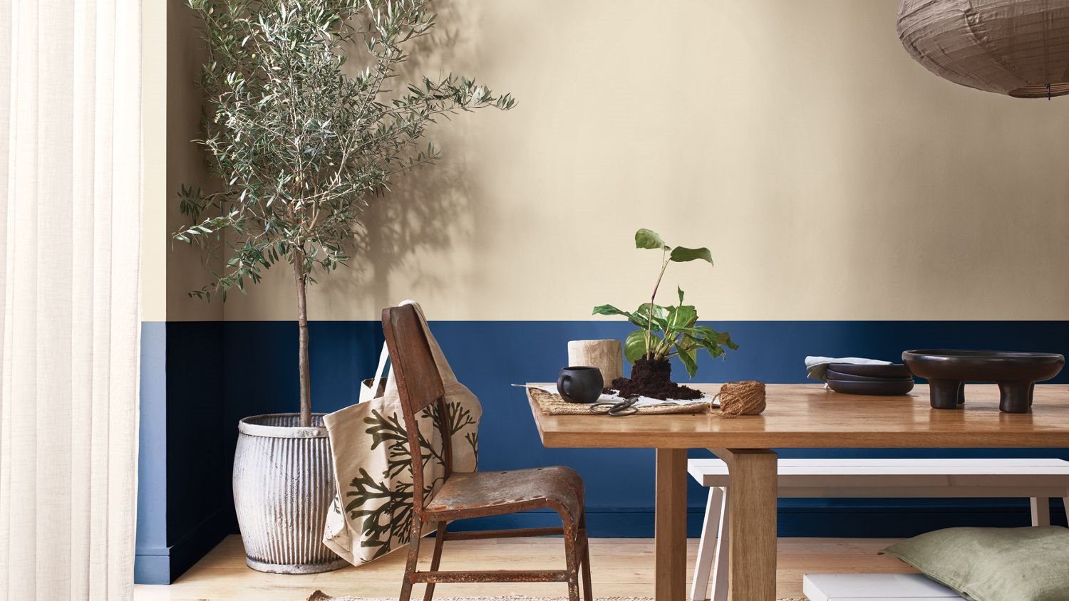 Dining room with beige and blue walls.  tricked tones