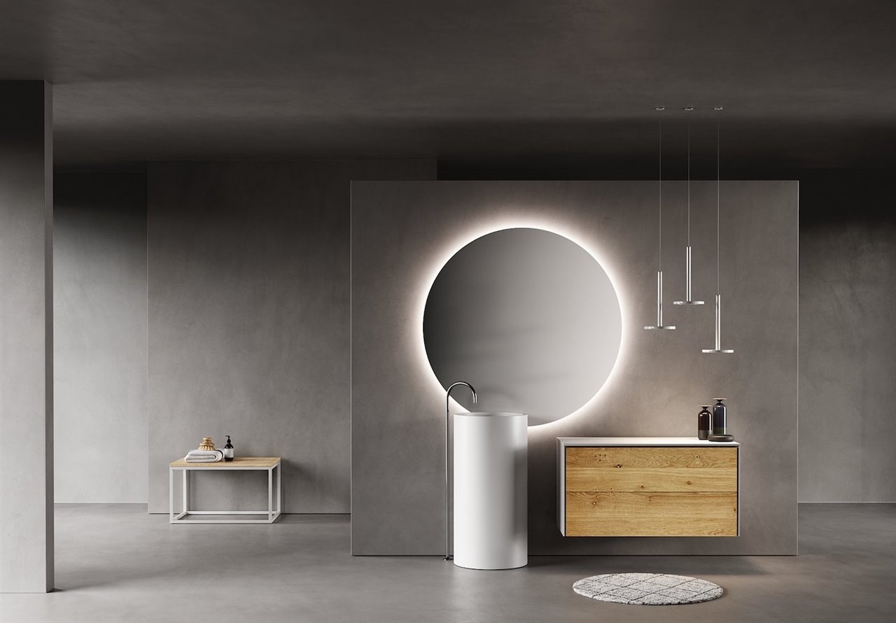 Serie Alma. Mueble con lateral fino blanco mate y frontal de roble macizo en acabado Legno. Encimera Plana Solid Surface blanco mate. Lavabo Tótem Solid Surface. Luz decorativa Ledcirc.