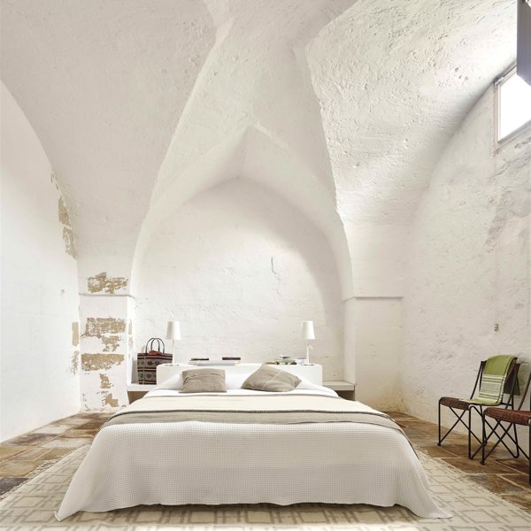 Dormitorio con bóvedas en acabado mortero